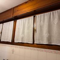 Tende ricamate a tombolo