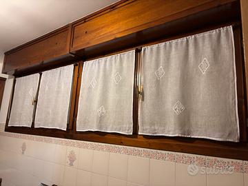 Tende ricamate a tombolo