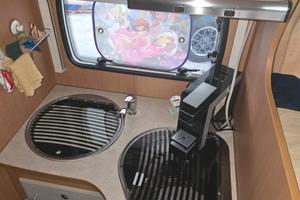 camper mansardato con letto nautico
