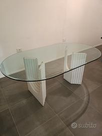 Tavolo in cristallo con basi in travertino 
