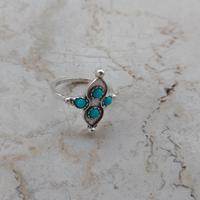 anello a croce con pietre turchesi