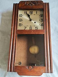 orologio a pendolo da parete