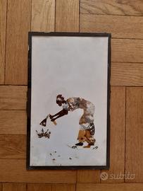 Collage con ali di farfalla arte africana