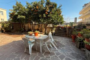 Ampio quadrilocale con giardino privato