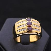 Anello bullow fascia oro 18kt brillanti e rubini