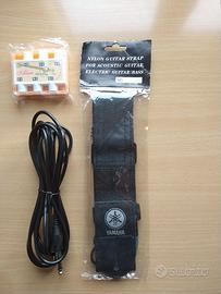 Tracolla, accordatore e cavo per chitarra.