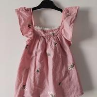 Abito rosa con volant ricamato