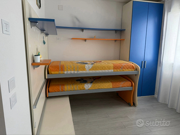 Cameretta con letti scorrevoli