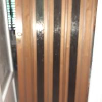 porta soffietto legno e vetro