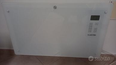 Convettore d'arredo con pannello in vetro