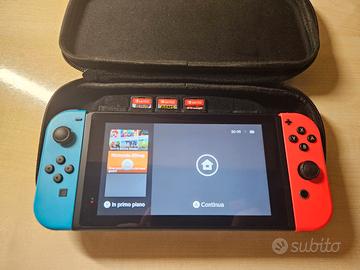 Nintendo Switch solo console+ 3 giochi + custodia 