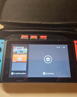 Nintendo Switch solo console+ 3 giochi + custodia 