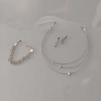 Collana, bracciale, orecchini. Color Argento