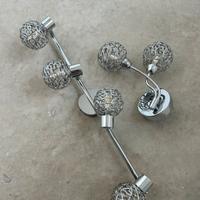 Faretti color argento e applique