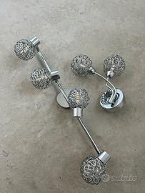Faretti color argento e applique