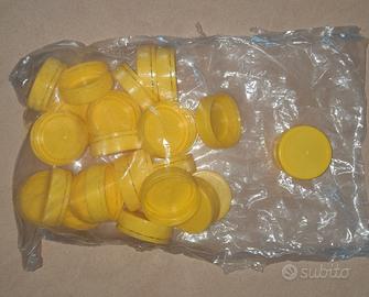 26 tappi nuovi di color giallo in PVC per dame PVC