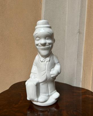 Statuina ceramica Stanlio vintage con valigia