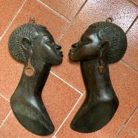 Visi africani di legno