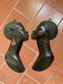 Visi africani di legno