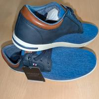 Eleganti scarpe in tela con dettagli in pelle.