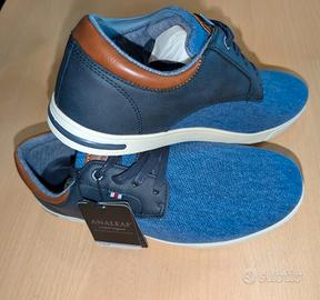 Eleganti scarpe in tela con dettagli in pelle.