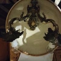 Antico applique in lega dorata