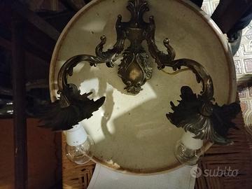 Antico applique in lega dorata