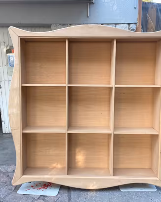 libreria a giorno sospesa grezza con cornice