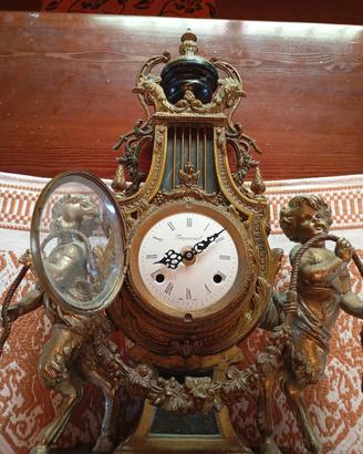 orologio e candelabri stile neoclassico 