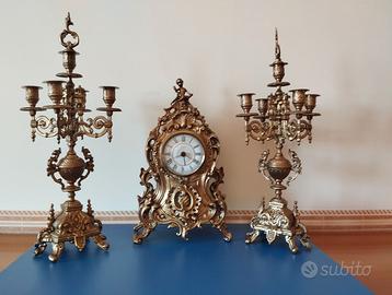 TRITTICO OROLOGIO E CANDELABRI