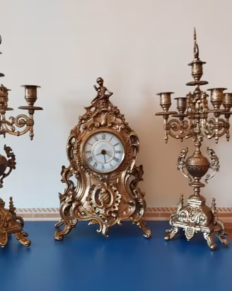 TRITTICO OROLOGIO E CANDELABRI