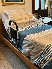 Letto con rete motorizzata e materasso