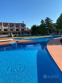 Appartamento a Caorle con piscina e giardino