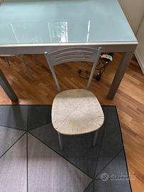 Tavolo da pranzo allungabile in vetro e acciaio