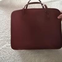 valigia in pelle rossa reataurata