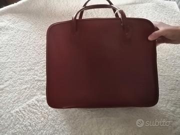 valigia in pelle rossa reataurata