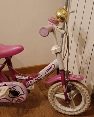 bicicletta rosa con seggiolino bambole