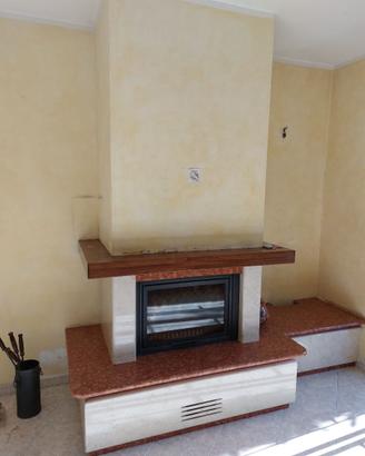Camino canalizzato Piazzetta HT600 e rivestimento