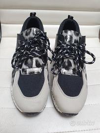 Sneaker con tacco interno