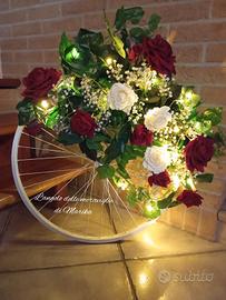 ruota cerchione addobbo con rose e luci