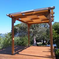 tettoia in legno massello e lamellare