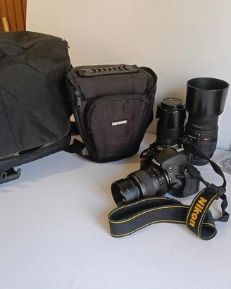 Nikon D5100 con tre obiettivi, filtri e borse 
