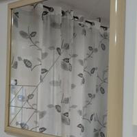specchio quadrato con disegno geometrico 