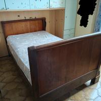Letto a barchetta in noce