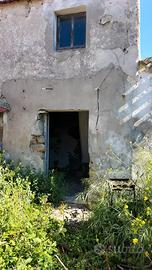 Terreno con casa da rifare centro storico Dolianov