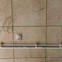 Sistema binario per tenda a soffitto a doppio uso;