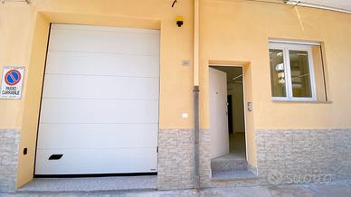 Trivano nuovo con cortile e garage privati