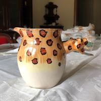 Brocca con manico a testa di leopardo