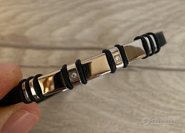 Bracciale nero con inserti metallici e brillanti