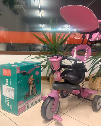 Triciclo SmartTrike rosa con accessori e scatola